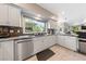 Modern kitchen with granite countertops and stainless steel appliances at 8904 Saint Pierre Dr, Las Vegas, NV 89134