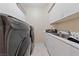 Laundry room with modern washer and dryer, and a utility sink at 8904 Saint Pierre Dr, Las Vegas, NV 89134