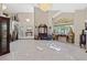 Spacious living room showcasing a two-story ceiling and chandelier at 8904 Saint Pierre Dr, Las Vegas, NV 89134