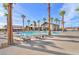 Resort-style pool with lounge chairs and palm trees at 2043 Arrington Ave, North Las Vegas, NV 89086