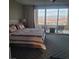 Main bedroom with king-size bed, access to balcony and stunning views at 49 Vista Outlook St, Henderson, NV 89011