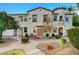 Two-story building exterior with landscaping and walkway at 50 Aura De Blanco St # 17101, Henderson, NV 89074