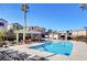 Community pool with lounge chairs and pergola at 50 Aura De Blanco St # 17101, Henderson, NV 89074