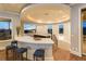 An elegant bar area with seating, sleek countertops, and scenic views at 8 Rue Mediterra Dr, Henderson, NV 89011