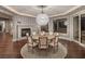 Formal dining room features a fireplace, modern lighting, and balcony access with sliding glass doors at 8 Rue Mediterra Dr, Henderson, NV 89011