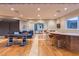 Spacious game room with poker and billiards tables, wet bar, and comfortable seating at 8 Rue Mediterra Dr, Henderson, NV 89011