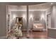 Elegant hallway with hardwood floors, decorative lighting, and neutral walls, creating a welcoming and stylish passage at 8 Rue Mediterra Dr, Henderson, NV 89011