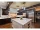 Gourmet kitchen features a large island, stainless steel appliances, and custom cabinetry at 8 Rue Mediterra Dr, Henderson, NV 89011