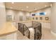 Bright landing features a custom railing and built-in cabinetry with beautiful countertop finishes at 8 Rue Mediterra Dr, Henderson, NV 89011