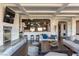 Open living room features a fireplace, views of the gourmet kitchen, and a spacious layout at 8 Rue Mediterra Dr, Henderson, NV 89011