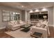 Bright living room featuring neutral décor, hardwood flooring, and a large window, offering serene mountain views at 8 Rue Mediterra Dr, Henderson, NV 89011