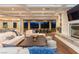 A spacious living room featuring a brick fireplace, hardwood floors, and expansive views at 8 Rue Mediterra Dr, Henderson, NV 89011