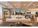 Bright, expansive living room with comfortable seating, hardwood floors, and stunning views at 8 Rue Mediterra Dr, Henderson, NV 89011