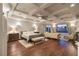 Spacious main bedroom featuring a tray ceiling, hardwood floors, and a large window, offering a peaceful retreat at 8 Rue Mediterra Dr, Henderson, NV 89011