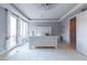 Bright main bedroom boasts a large window and access to outdoor living area at 8 Rue Mediterra Dr, Henderson, NV 89011