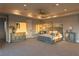 A serene main bedroom featuring soft lighting, carpeted floors, and stylish furnishings at 8 Rue Mediterra Dr, Henderson, NV 89011