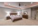 Large main bedroom with a king bed, dresser, and soft lighting at 8 Rue Mediterra Dr, Henderson, NV 89011