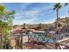 Backyard pool and elevated spa featuring manicured landscaping and wrought iron railings at 8 Rue Mediterra Dr, Henderson, NV 89011
