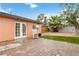 Backyard patio with lawn, palm tree, and French doors at 1925 Franklin Ave, Las Vegas, NV 89104