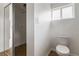 This features a clean and simple bathroom with a toilet and a closet for storage at 1925 Franklin Ave, Las Vegas, NV 89104