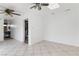 Bonus room with tiled floors, white walls, a skylight, and access to a utility area at 1925 Franklin Ave, Las Vegas, NV 89104