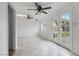 Bonus room with a ceiling fan, tiled floors, white walls and natural light from glass doors at 1925 Franklin Ave, Las Vegas, NV 89104