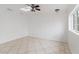 Bonus room with tiled floors, white walls, a skylight, ceiling fan, and a large window at 1925 Franklin Ave, Las Vegas, NV 89104
