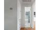 Hallway with built-in storage that leads to an updated bathroom with shower and tub combo at 1925 Franklin Ave, Las Vegas, NV 89104