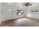 Bright living room with tiled floors, large windows providing ample natural light, and a classic ceiling fan at 1925 Franklin Ave, Las Vegas, NV 89104