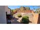 Landscaped backyard with patio and seating area at 6647 Rego Park Ct, Las Vegas, NV 89166