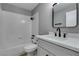 Renovated bathroom features sleek fixtures, white tile and modern gray accents at 6807 Sebring St, Las Vegas, NV 89103