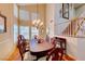 Formal dining room with tall ceilings and classic chandelier lighting at 8240 Campana Dr, Las Vegas, NV 89147