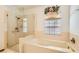 Bathroom with shower, bathtub, and updated fixtures at 3189 Lipton Ct, Las Vegas, NV 89121