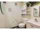 Simple bathroom with toilet, sink, and wall cabinets at 3189 Lipton Ct, Las Vegas, NV 89121