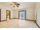 Bedroom with tile floors, sliding glass doors, and bathroom access at 3189 Lipton Ct, Las Vegas, NV 89121