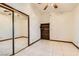 Bedroom with mirrored closet doors and a built-in bookshelf at 3189 Lipton Ct, Las Vegas, NV 89121