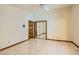 Simple bedroom with mirrored closet doors and tile floors at 3189 Lipton Ct, Las Vegas, NV 89121