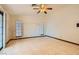 Bedroom with tile floors and sliding glass doors to backyard at 3189 Lipton Ct, Las Vegas, NV 89121