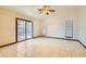 Bedroom with tile floors and sliding glass doors to patio at 3189 Lipton Ct, Las Vegas, NV 89121