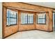 Bright dining area with wood paneled walls and window seating at 3189 Lipton Ct, Las Vegas, NV 89121