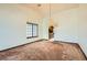 Dining room with a chandelier and views into the kitchen at 3189 Lipton Ct, Las Vegas, NV 89121