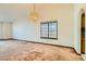 Bright living room with a large window and chandelier at 3189 Lipton Ct, Las Vegas, NV 89121