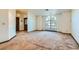 Spacious living room with large windows and neutral carpeting at 3189 Lipton Ct, Las Vegas, NV 89121