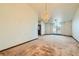 Spacious living room featuring a large window and a crystal chandelier at 3189 Lipton Ct, Las Vegas, NV 89121