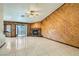 Spacious living room with tile flooring, fireplace and sliding glass doors at 3189 Lipton Ct, Las Vegas, NV 89121