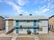 Multi-Gathering home with stucco siding and rock facade, featuring a balcony and blue trim at 4740 Corsaire Ave, Las Vegas, NV 89115