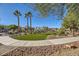 Landscaped community with grassy area and walking paths at 5179 Silica Chalk Ave, Las Vegas, NV 89115