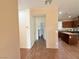 Home hallway with access to bedrooms and kitchen at 5179 Silica Chalk Ave, Las Vegas, NV 89115