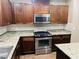 Kitchen with granite countertops and stainless steel appliances at 5179 Silica Chalk Ave, Las Vegas, NV 89115