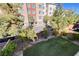 Backyard with a grassy lawn and a view of a building at 3164 Rowan Brook Ave, Henderson, NV 89052